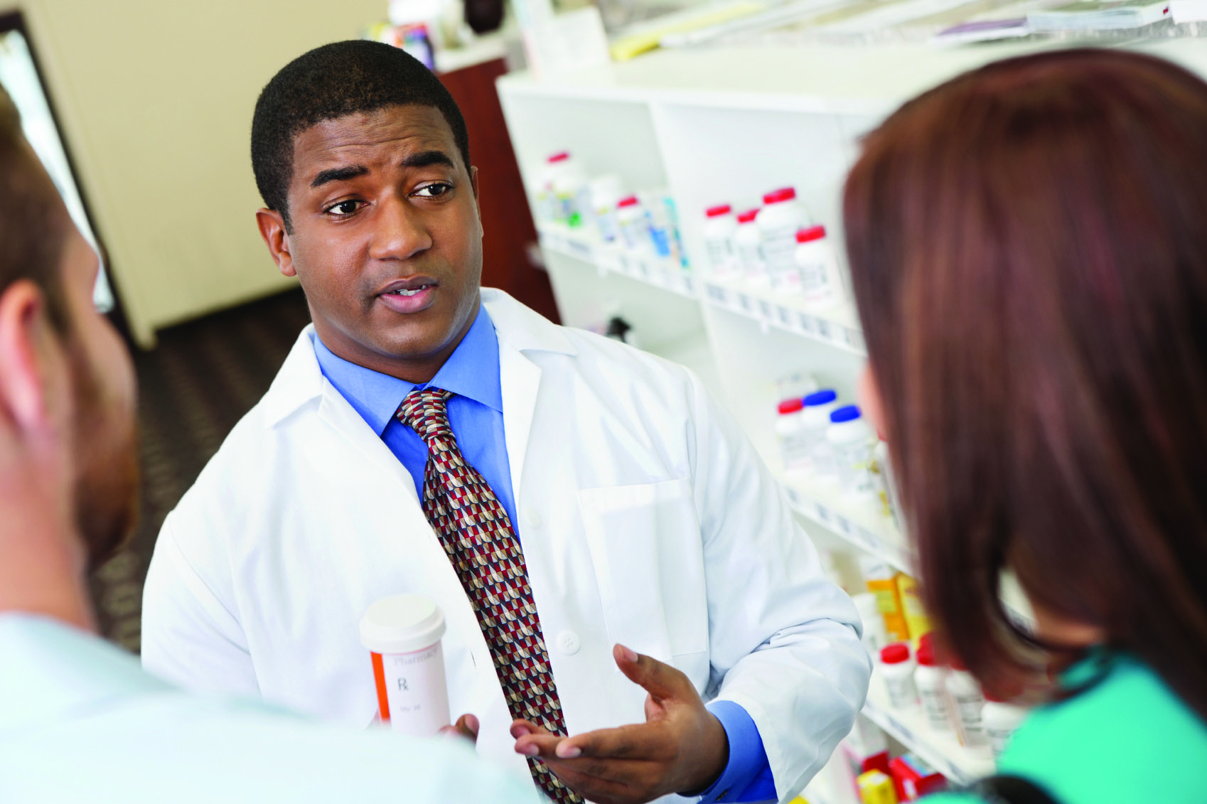 pharmacist_discussing medicines_customers_OK.jpg